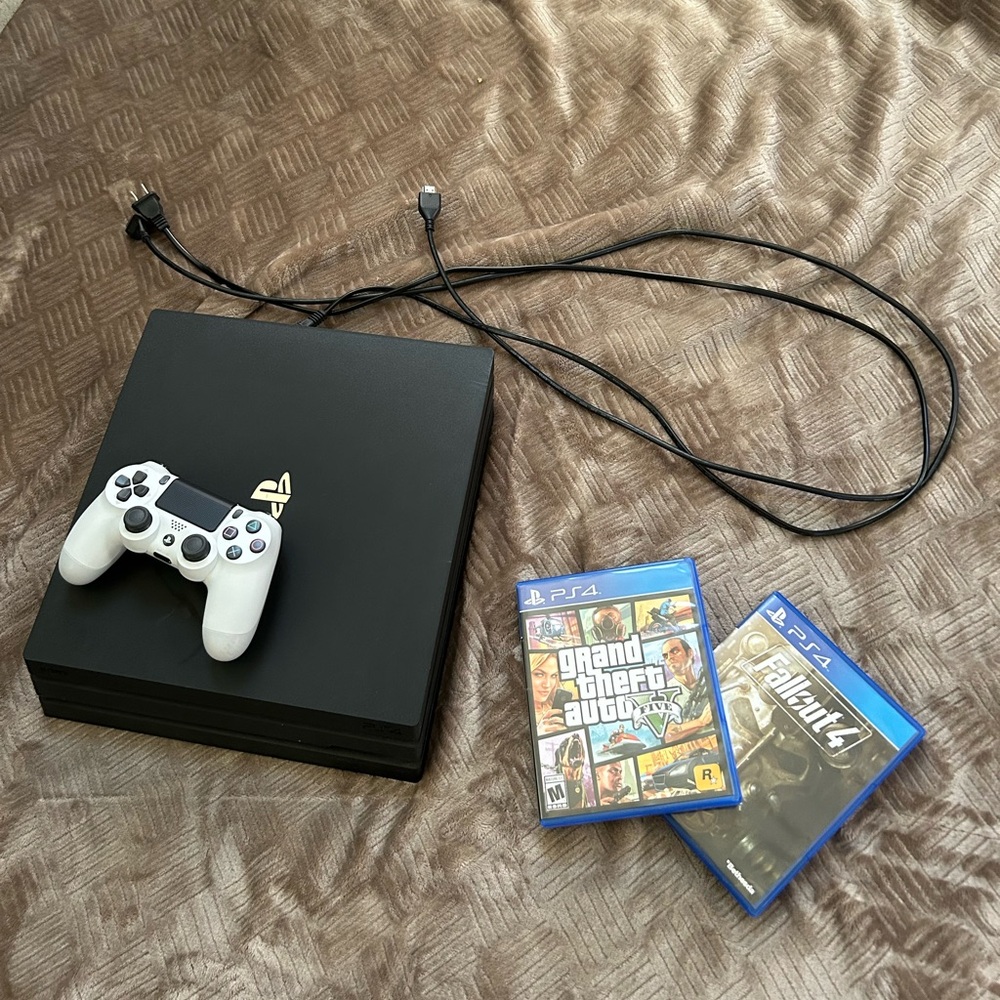 PS4 Pro + Controller + Power Cord + HDMI Cord + 2 Games